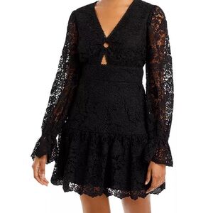 V-neck/O-ring detail Long sleeves A-line silhouette Concealed back zip closure